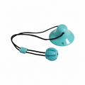 A turquoise pet toy consisting of a suction cup base, a textured ball with raised nubs, and black elastic cords, shown on a plain white background.